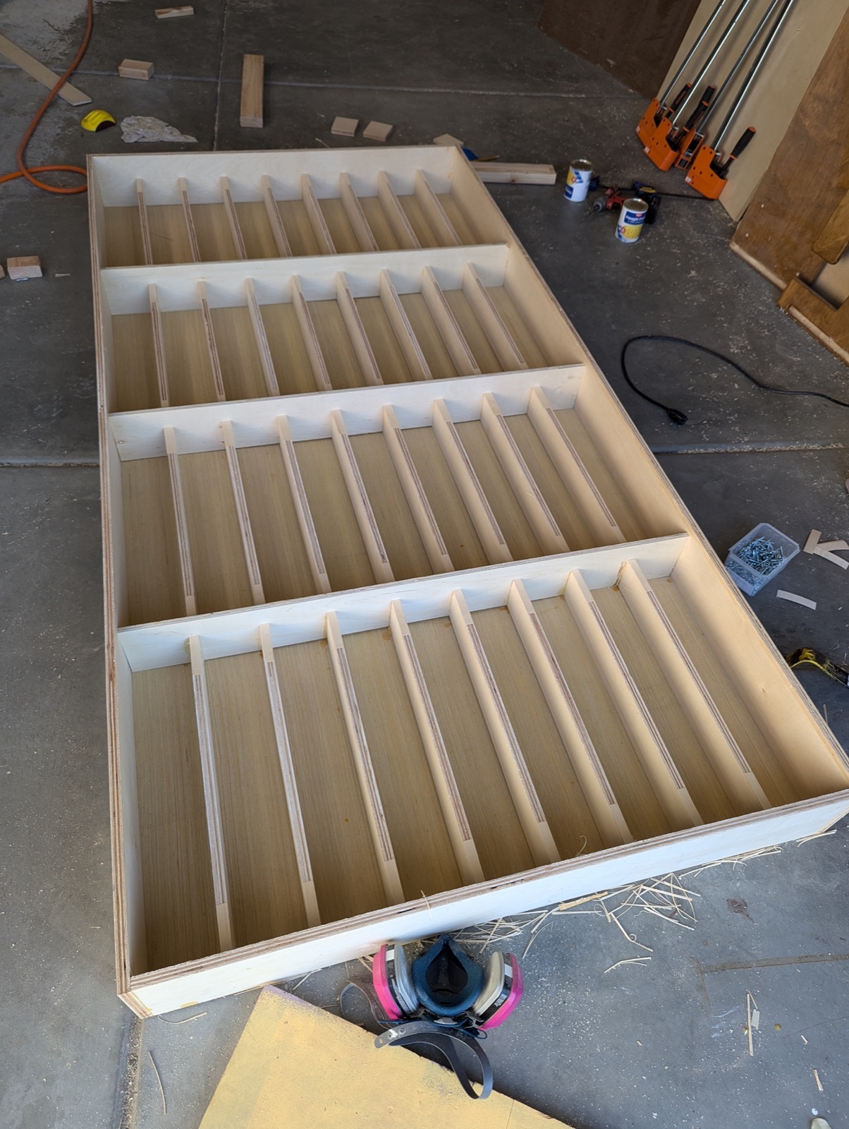 Plywood shelves and spacers for the can rotation system