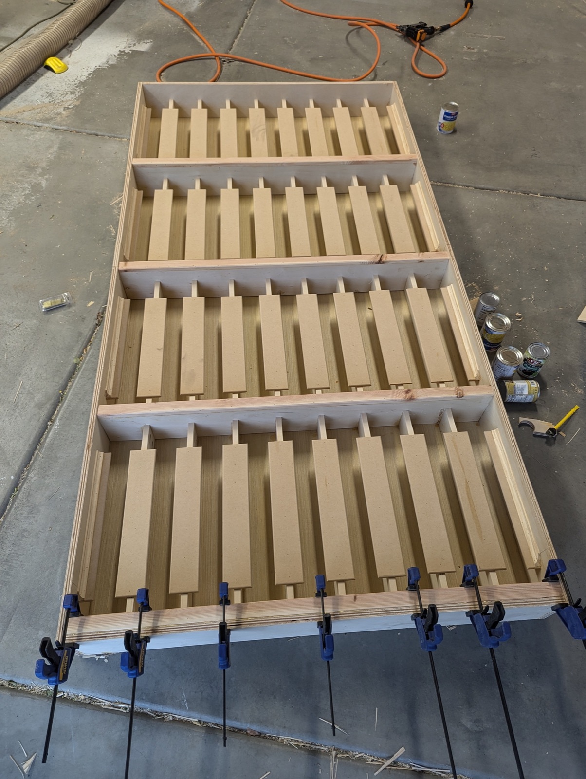 Face frame and can holders for the can rotation system