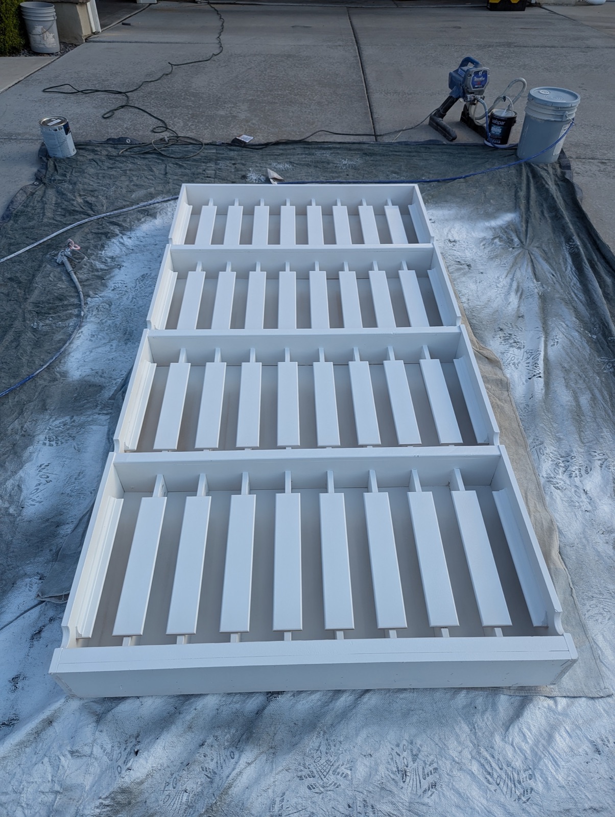 Cabinet-grade gloss paint sprayed on the can storage system
