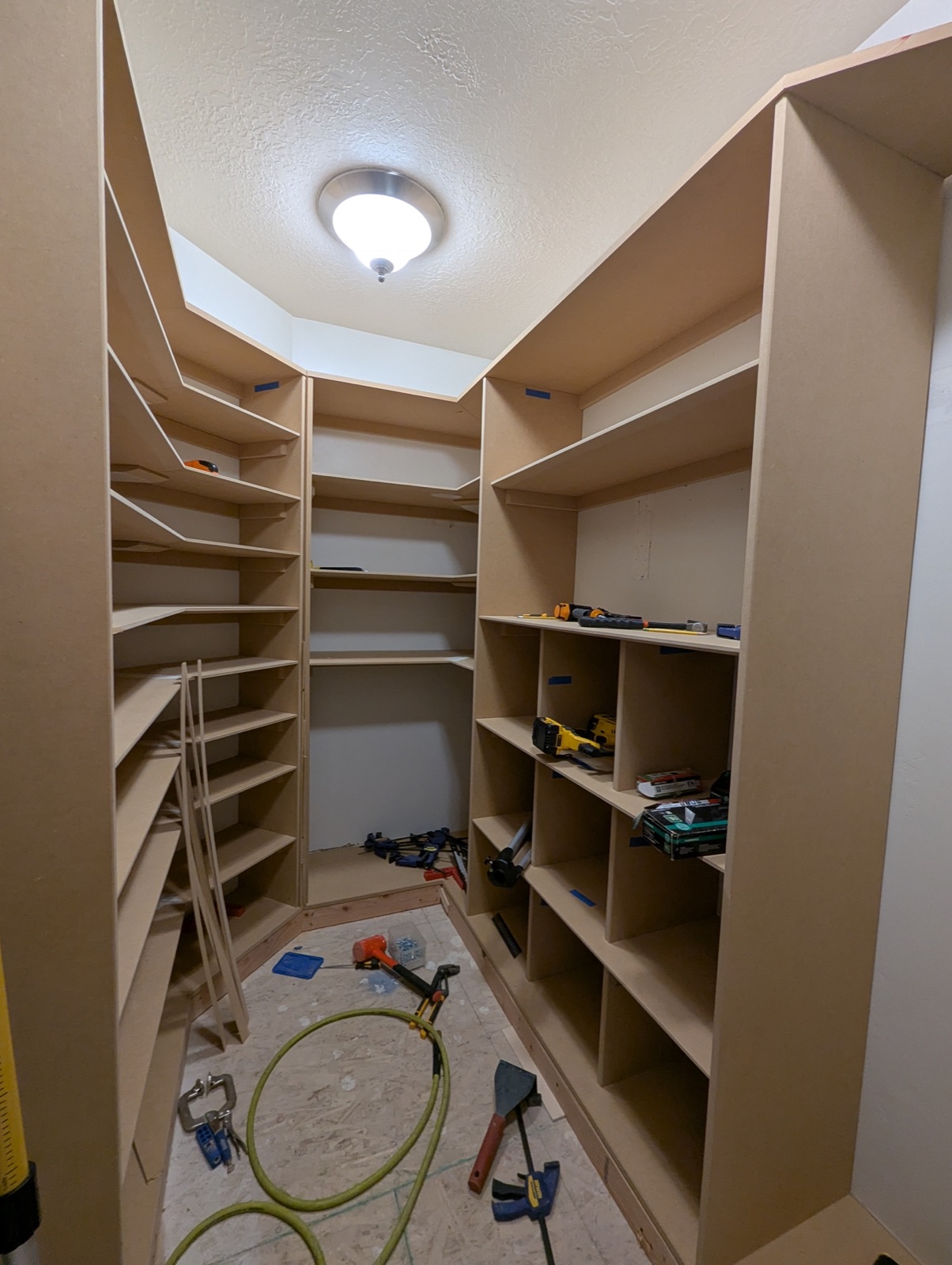 Shoe shelves and cubbies being installed