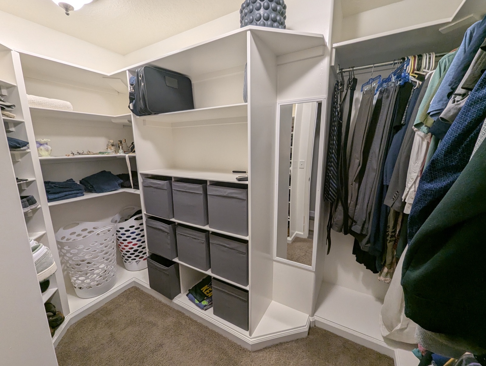 Finished closet built-ins with cubbies, shoe shelves, and hanging rods