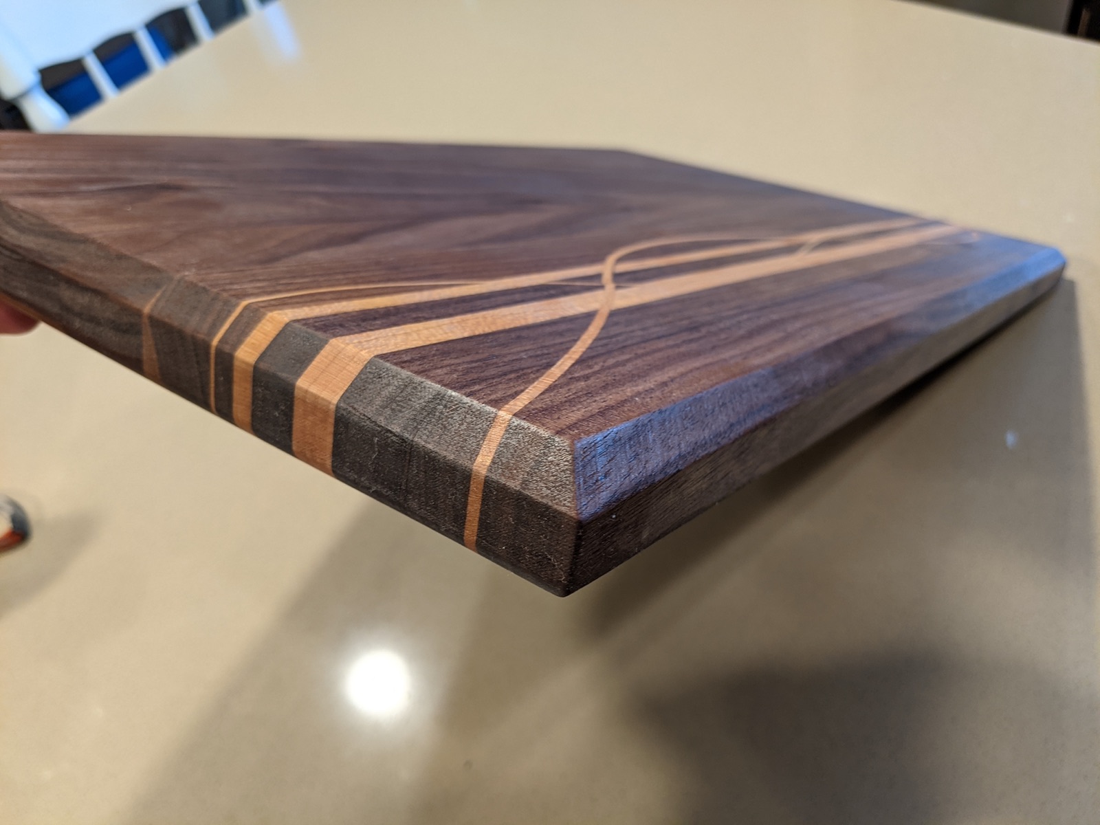 Bottom profile and ribbon detail on the cutting board