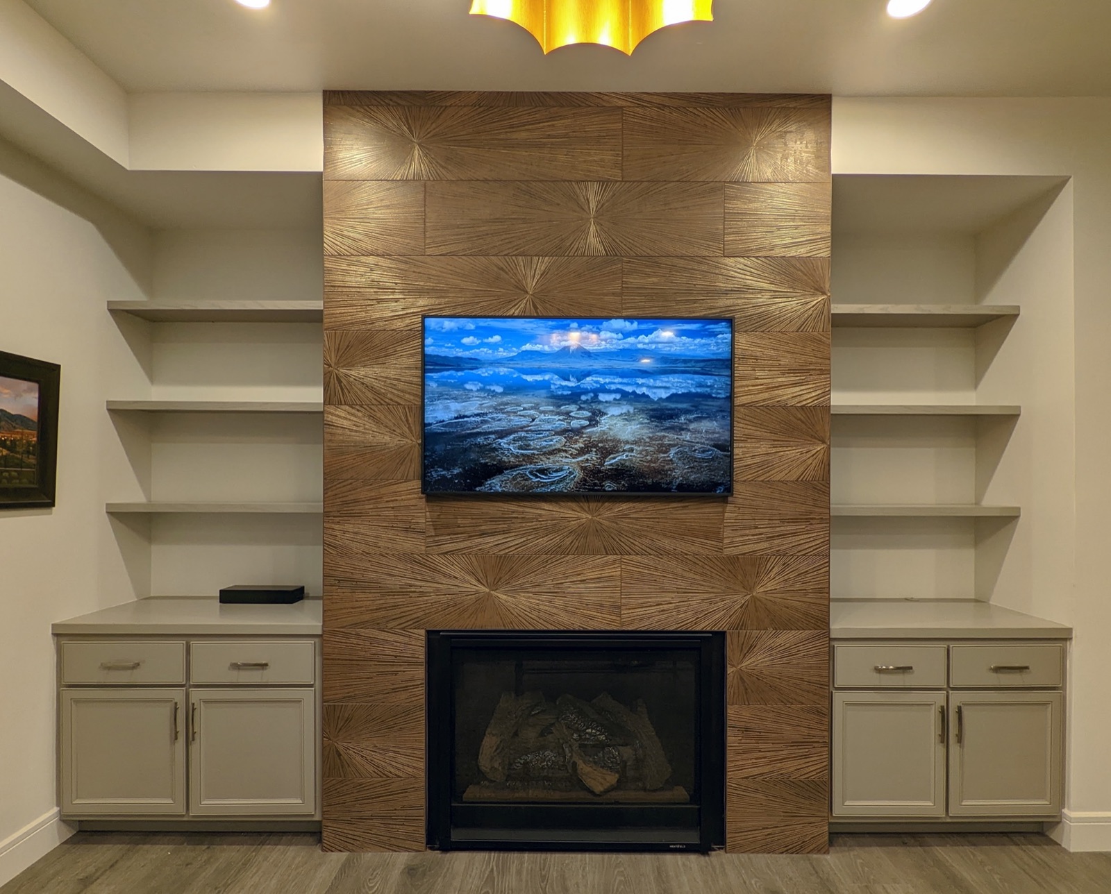 Cabinets and shelves installed beside the fireplace