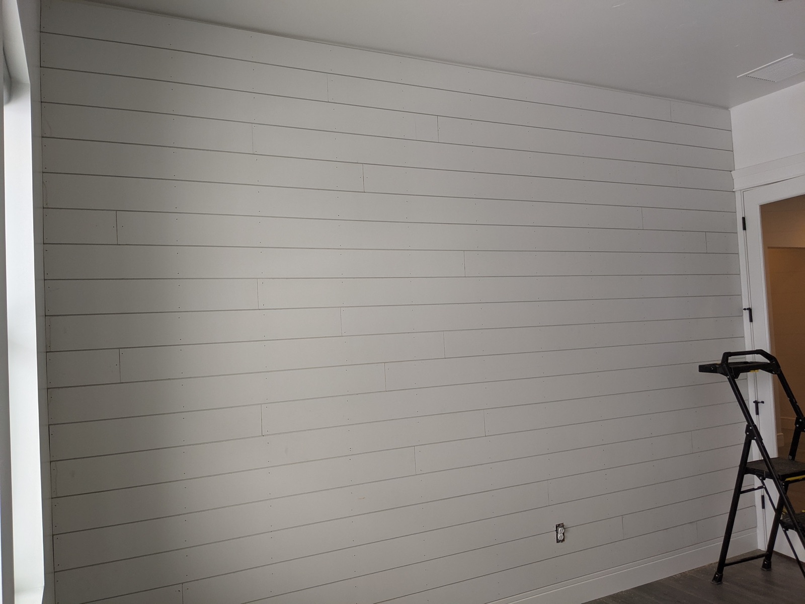 Shiplap accent wall installed